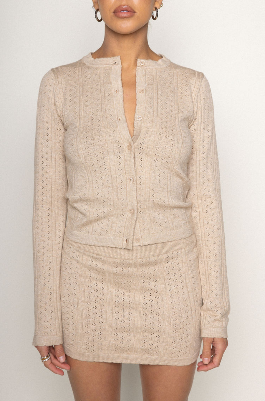 TOP
tan Knit eyelet cardigan
Scollop trim
Front button closure
Unlined

SKIRT
tan Knit eyelet mini skirt
Scallop trim
Elastic waistband
Unlined

summer knit set
spring knit set