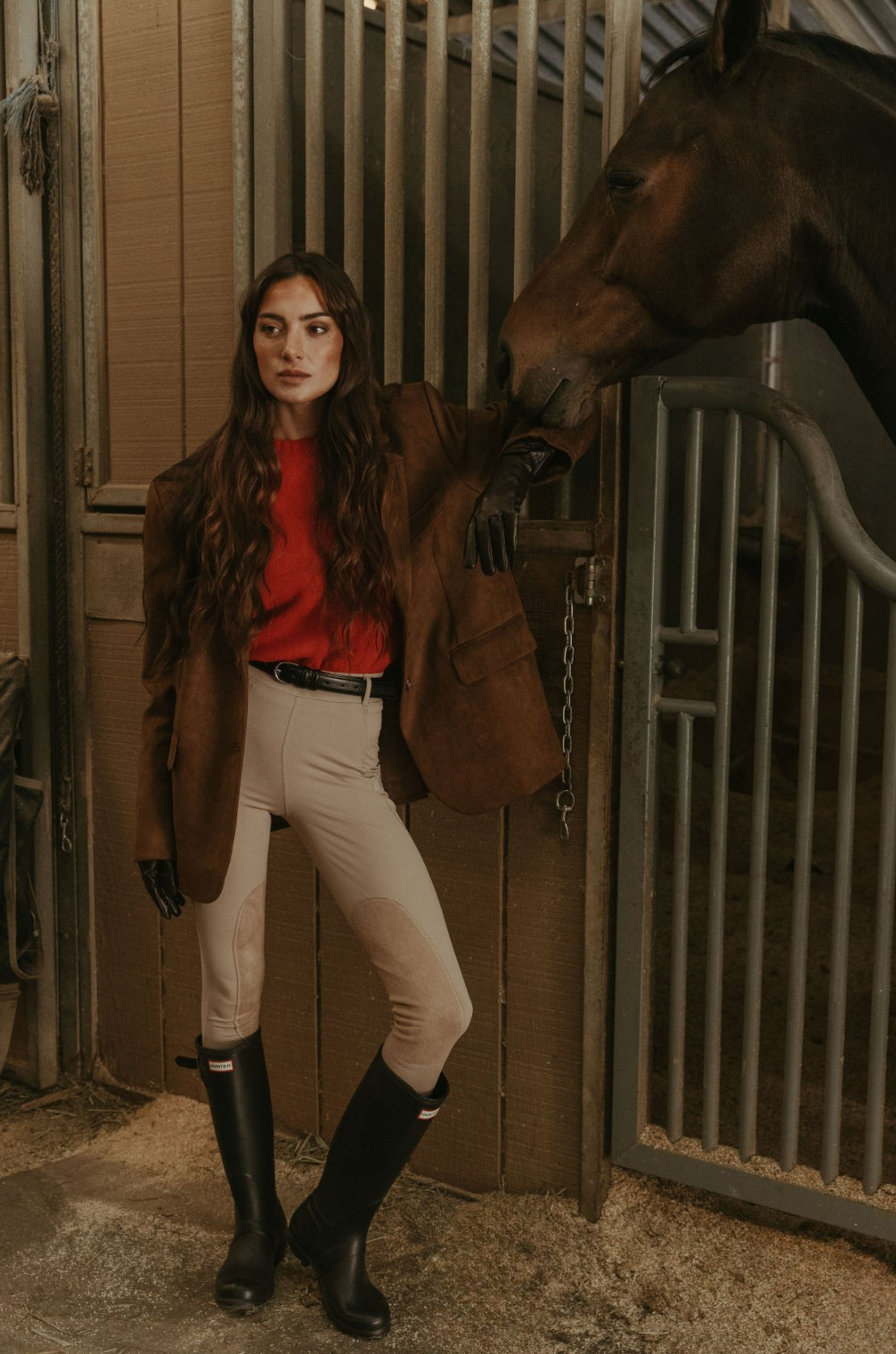 Faux suede single breasted blazer. Collar neckline. Front button closures. Front pockets. Long sleeves with faux button closures. Back slit. Fully lined. brown suede blazer. 