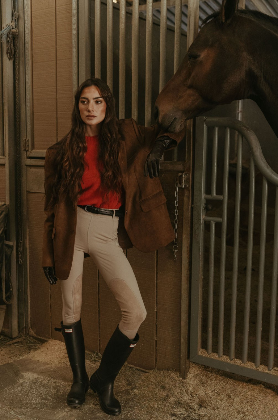 Faux suede single breasted blazer. Collar neckline. Front button closures. Front pockets. Long sleeves with faux button closures. Back slit. Fully lined. brown suede blazer. 