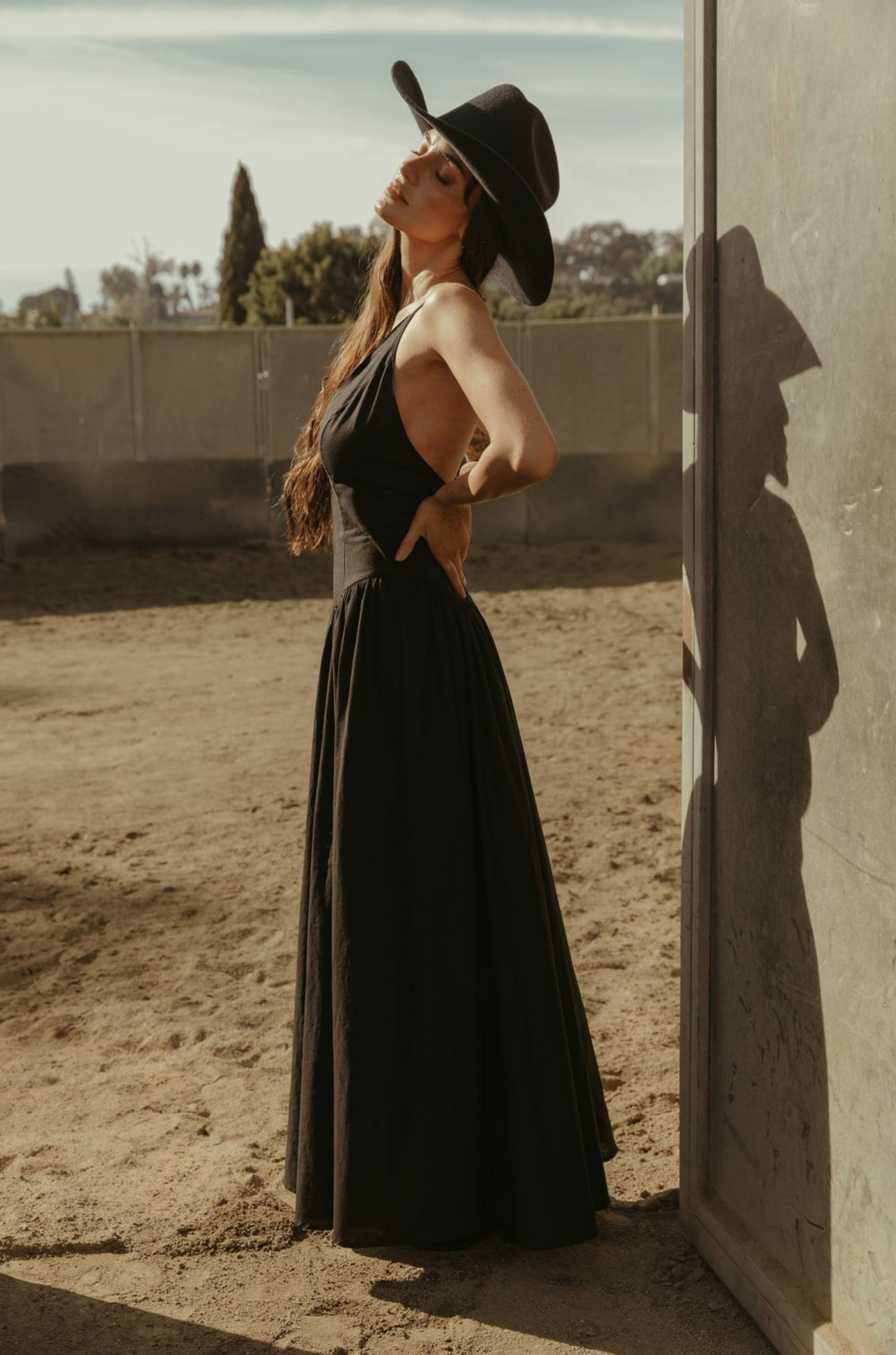 Woven maxi dress. Adjustable crisscross back straps. Back hook and eye and zipper closures. Fully lined. black maxi dress. country outfit. country dress. western outfit. western dress.