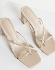 cream stone Cross over strap heels
Squared toe
Block heel