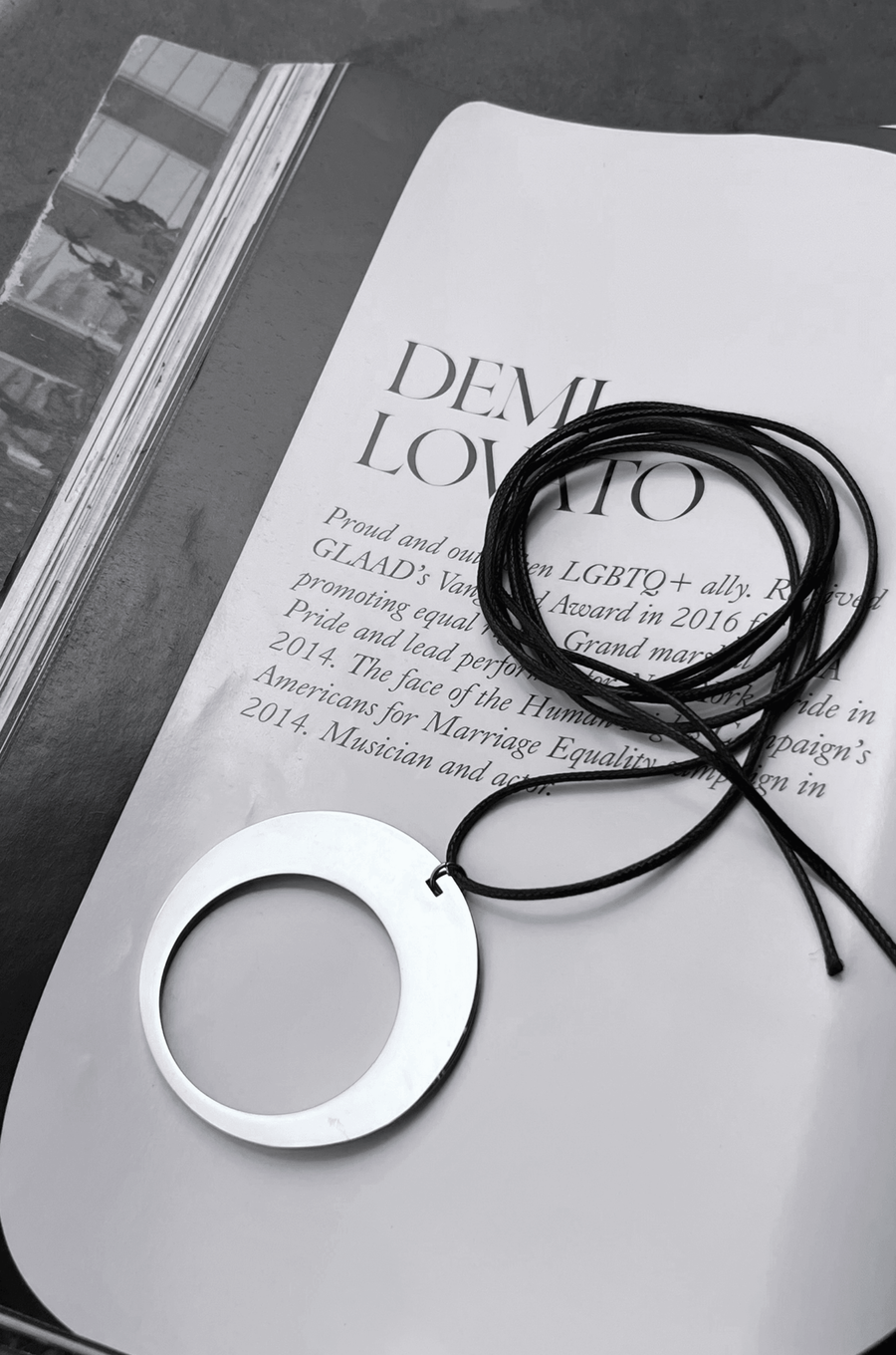 Silver pendant necklace with black rope