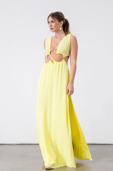 Crinkle woven sleeveless maxi dress. Waist cut outs. Side slits. Back tie closure. Back drawstring waist closure. Partially lined. vacation dress. beach dress. yellow maxi dress. 