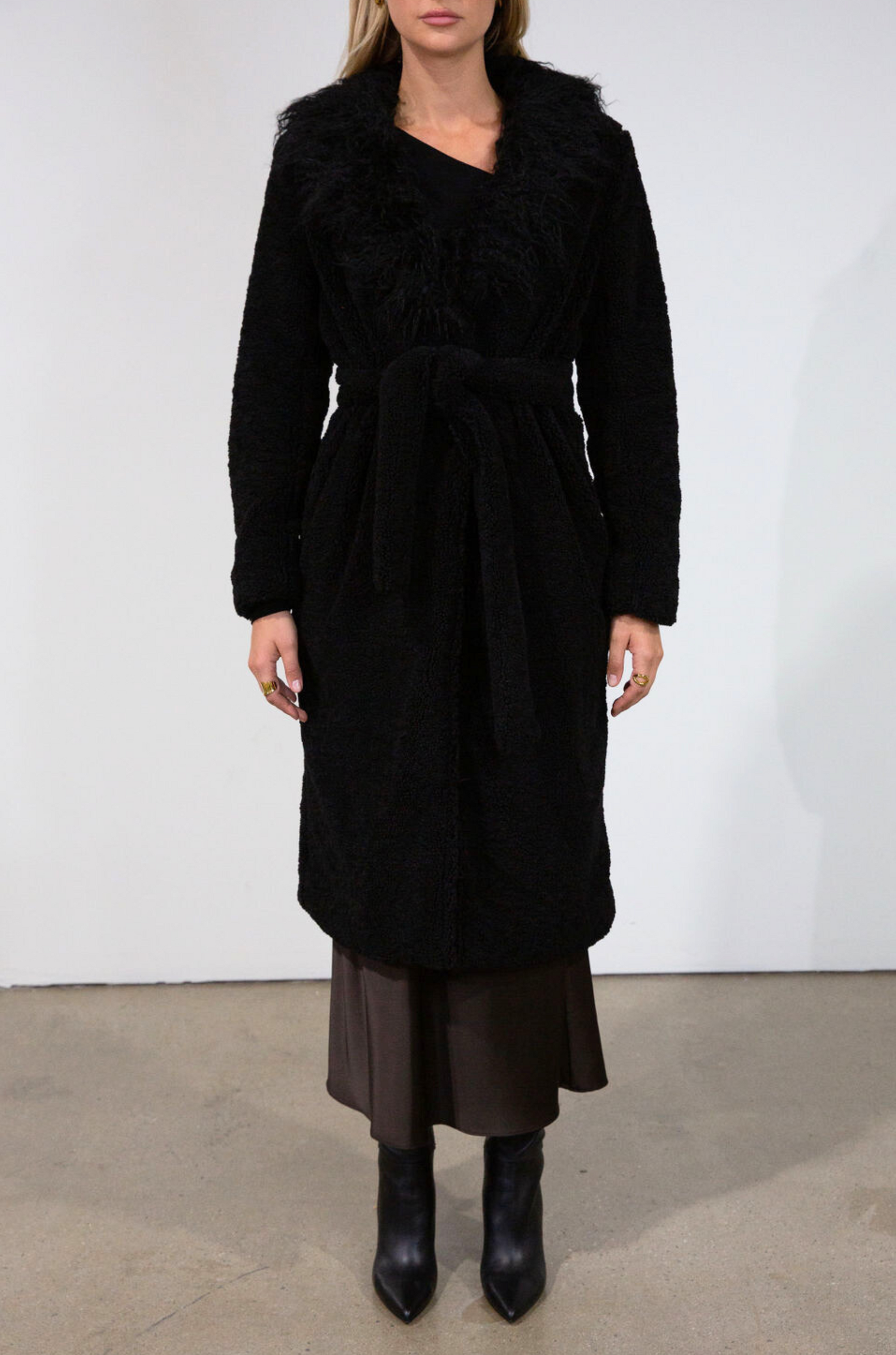 Black Faux sherpa longline coat. Faux fur collar neckline. Front snap button closure. Tie waist. Side pockets. Back slit. Fully lined. long coat. coat for new york. fall coat. fall outfit