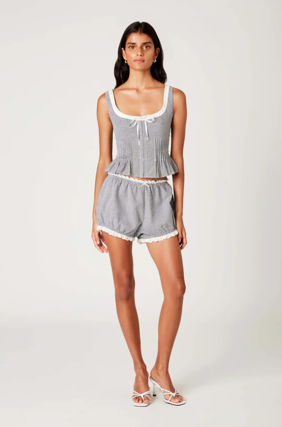 Gingham printed bloomer shorts
Elastic waistband with delicate bow detail
Eyelet lace trim
Fully lined
black and white gingham bloomer shorts