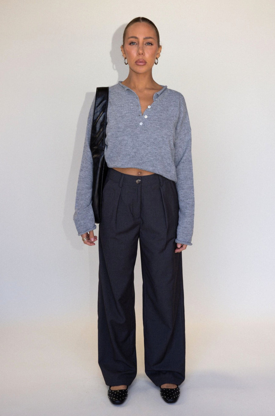 Grey woven trouser pants. Button and zipper fly. Side pockets. Faux back pocket. Unlined. Grey work slack