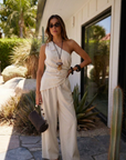 cream One shoulder linen top
Asymmetrical hem
Cinchable side
Zipper closure
resort outfit