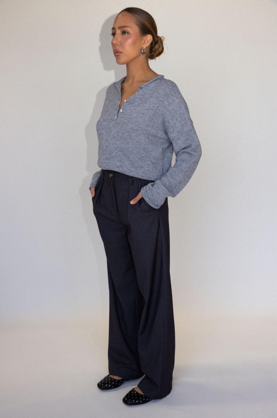 Grey woven trouser pants. Button and zipper fly. Side pockets. Faux back pocket. Unlined. Grey work slack