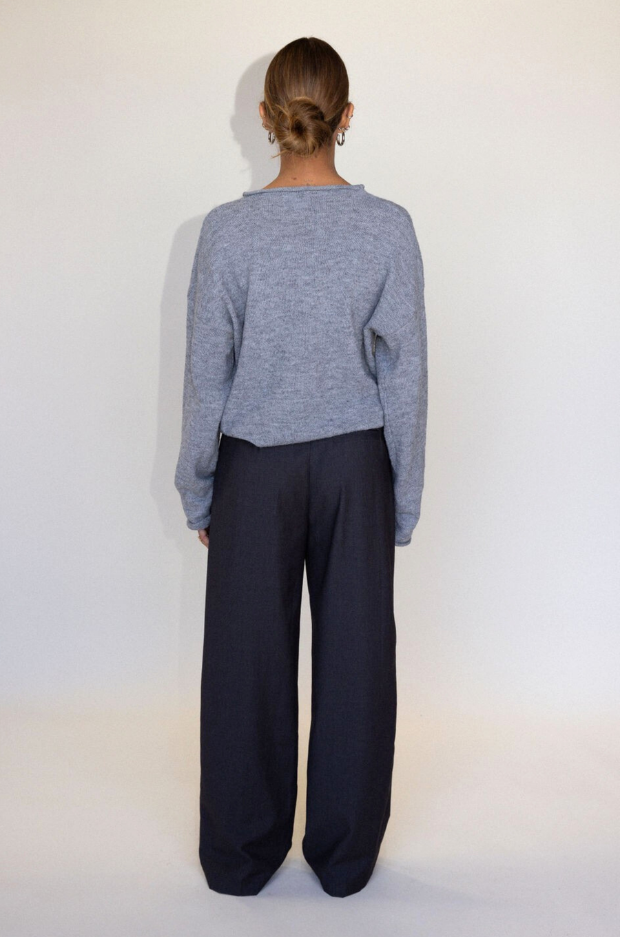 Grey woven trouser pants. Button and zipper fly. Side pockets. Faux back pocket. Unlined. Grey work slack