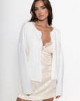 white Knit long sleeve cardigan
Rolled collar
Button down closure
Unlined
ivory cardigan