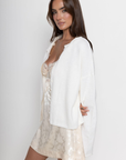white Knit long sleeve cardigan
Rolled collar
Button down closure
Unlined
ivory cardigan