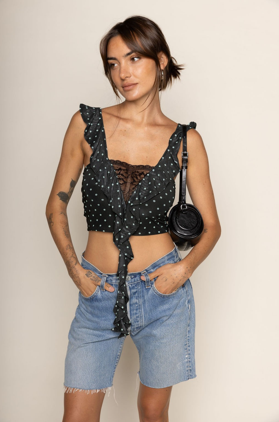 Polka dot mesh cropped tank top
Cascading ruffles
Sheer lace pane
V-neckline
Sleeveless
polka dot crop top
going out top