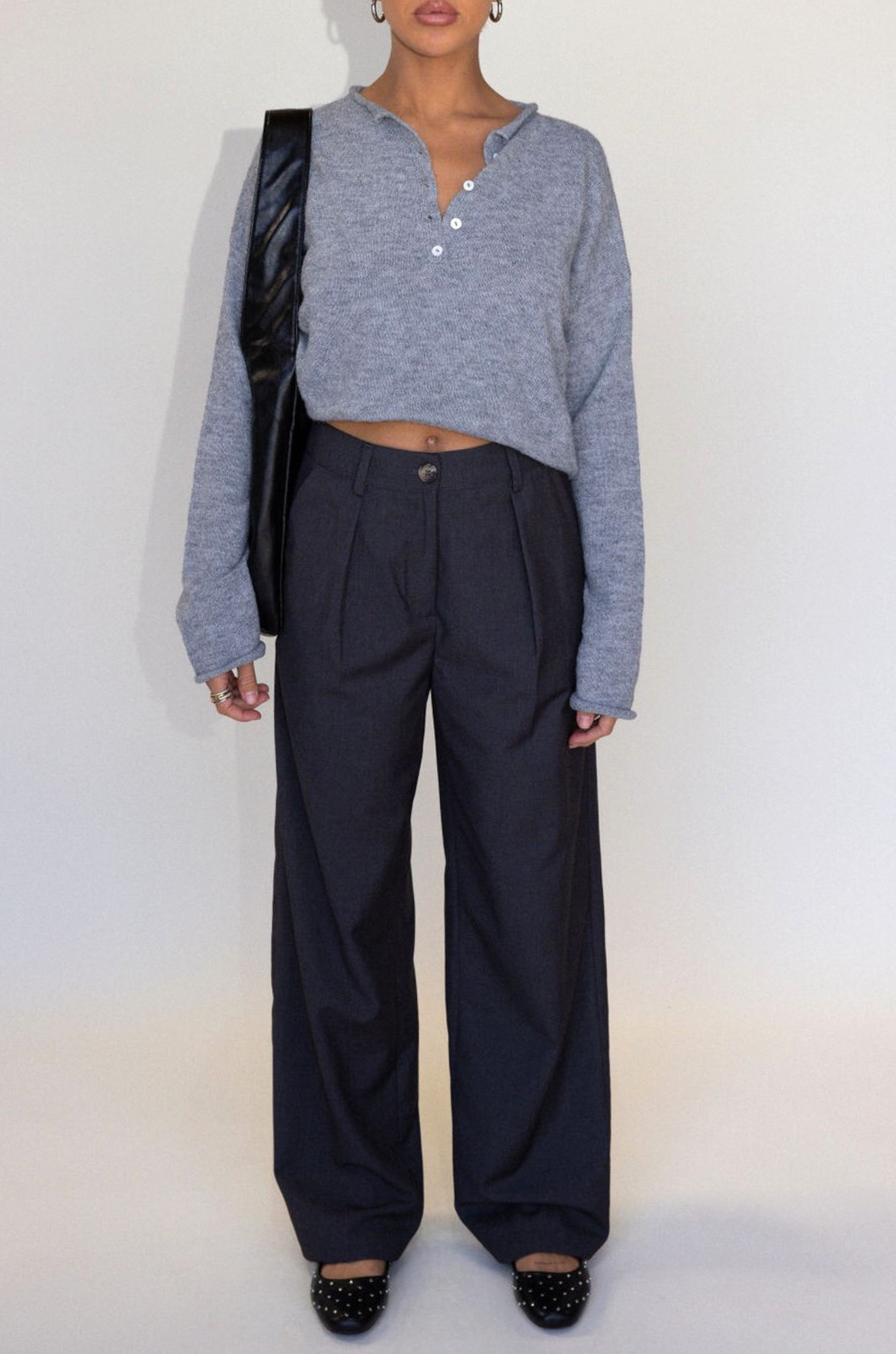 Grey woven trouser pants. Button and zipper fly. Side pockets. Faux back pocket. Unlined. Grey work slack