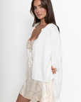 white Knit long sleeve cardigan
Rolled collar
Button down closure
Unlined
ivory cardigan