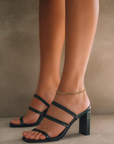 Emely by Billini is a black classic mid block heel. Heel height 9cm.

mid block heel
open square toe
medium, flat toe strap
strap across vamp
elasticated sling back strap
exposed heel counter
synthetic upper, lining and outsole