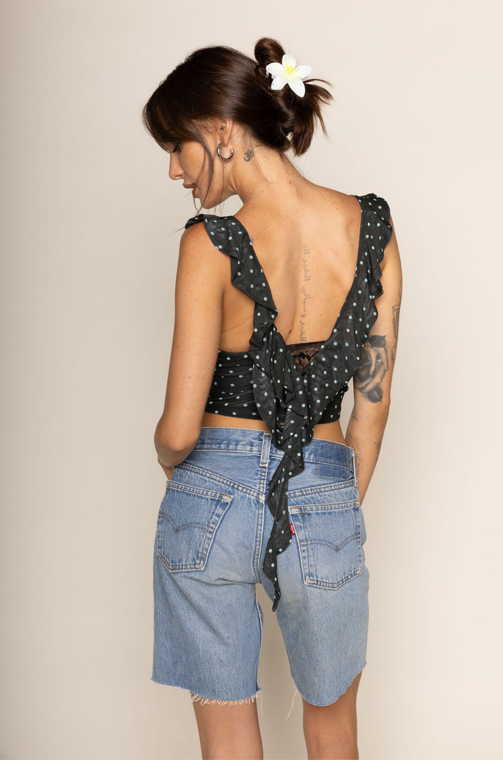Polka dot mesh cropped tank top
Cascading ruffles
Sheer lace pane
V-neckline
Sleeveless
polka dot crop top
going out top