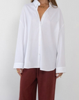 white Woven oversized button down shirt
Collar neckline
Long sleeves with button closures
Front button down closure
Unlined
Cotton/Nylon/Spandex