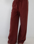 burgundy maroon Stipe wide leg pant
Grey pant with white stripe
Single bonding at side
Elastic waistband
Side pockets
Unlined
fall transition outfit