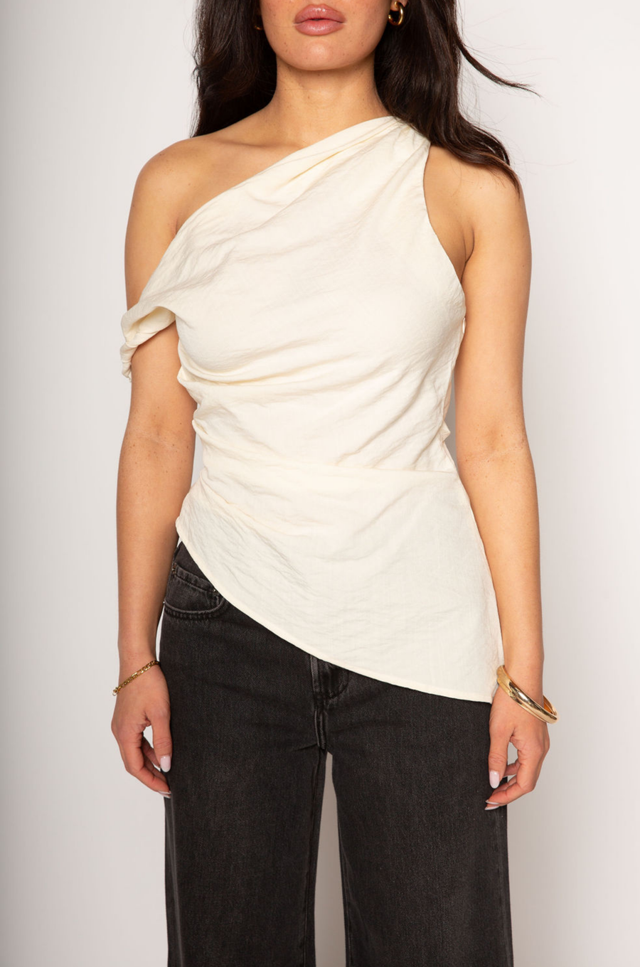 Woven top. Fixed straps. Twist strap. Ruched side. Asymmetric hem. Unlined. cream linen top. asymmetrical top. summer top. resort wear. beach vacation. 