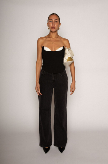 Relaxed fit straight leg jeans. Mid rise. Button and zipper fly. Five pocket construction. Unlined. black denim jeans.