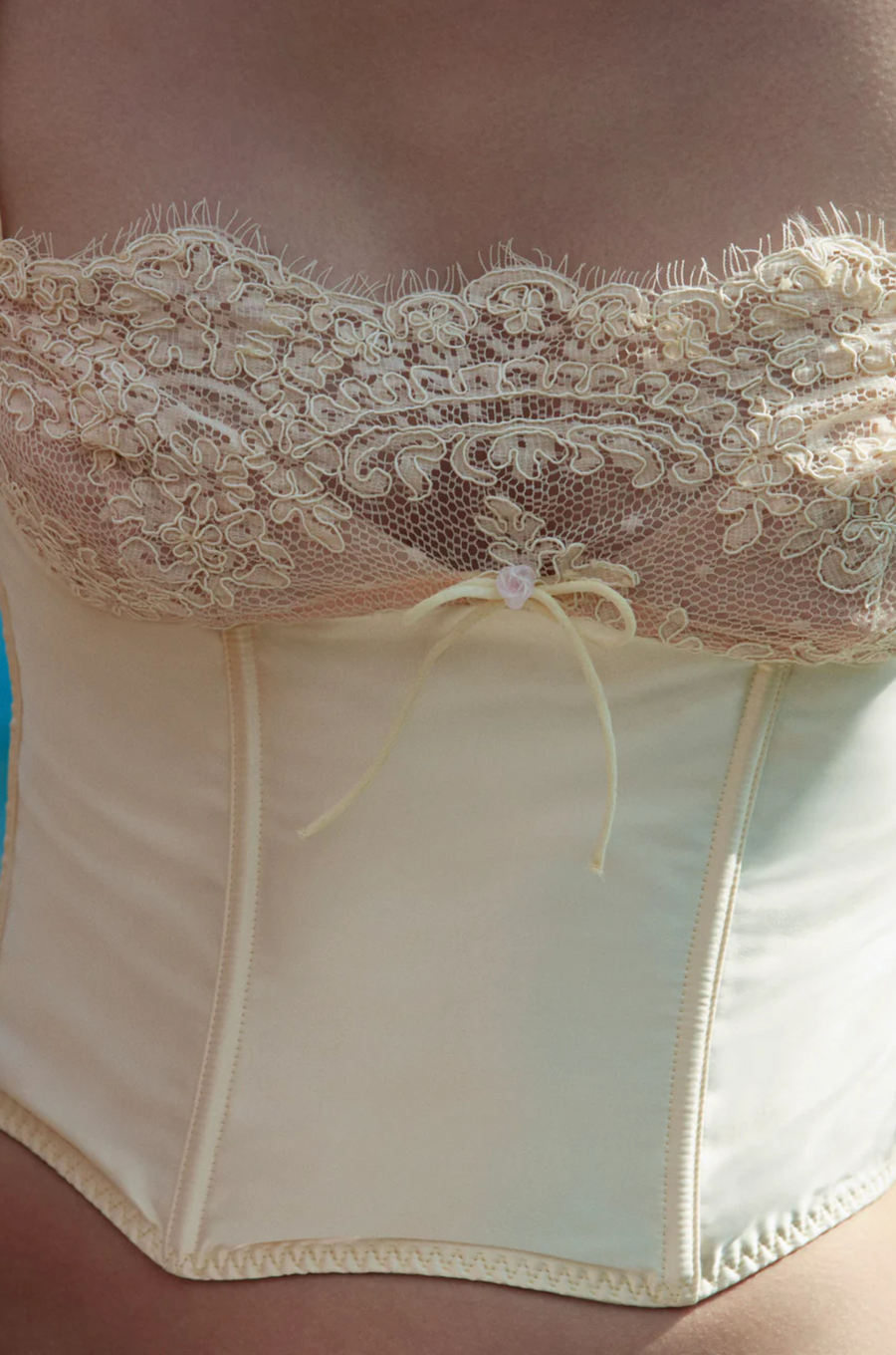 cream Sleek satin bustier with lace detailing
Fully boned bodice
Adjustable lace-up back
Skinny tie bow
Rosette adornments
Lined at cups
Adjustable shoulder straps
Polyester/Elastane
cream ligneire bustier top
