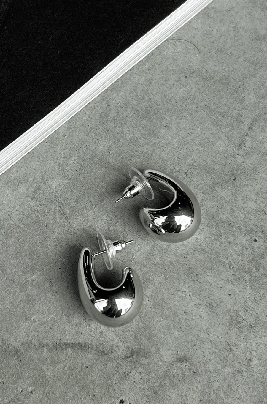 silver Thick teardrop earrings. Post back closure.