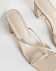 cream stone Cross over strap heels
Squared toe
Block heel