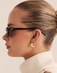 black Slimline cateye sunglasses
Soft, subtle lift through the frame
Acetate frame
Gold metal tip detailing
Polarised, scratch-resistant Category 3 lenses
100% UV protection
Width: 14.5cm / Lens Height: 3.85cm / Arm Length: 14.5cm / Nose Bridge: 2cm