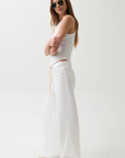Cut to sit low on the hips
Relaxed rise
Easy adjustable drawstring waist tie
Wide, fluid leg
Constructed from non-stretch denim
Size 26 measurements:
Rise: 11" / Inseam: 32 1/2" / Leg Opening: 24"
Cotton/Lyocell
white denim jeans