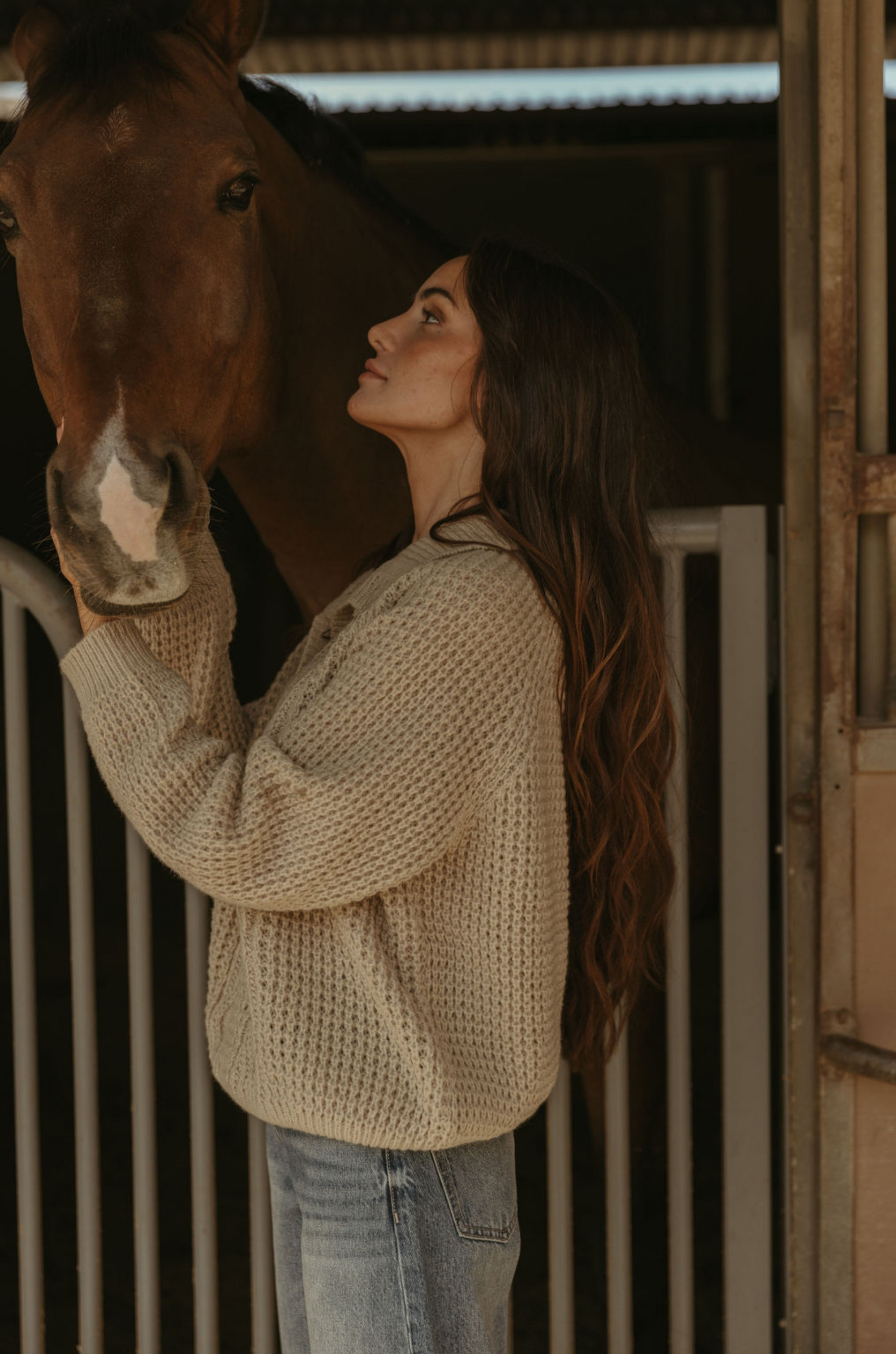 Fuzzy mixed knit crochet sweater. Collar neckline. Front button closures. Long sleeves. Banded hems. Unlined. tan sweater. knit sweater. quarter button up sweater