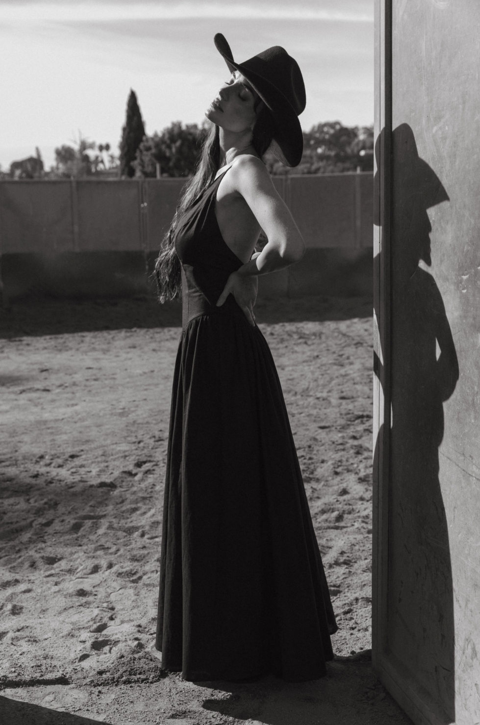 Woven maxi dress. Adjustable crisscross back straps. Back hook and eye and zipper closures. Fully lined. black maxi dress. country outfit. country dress. western outfit. western dress.