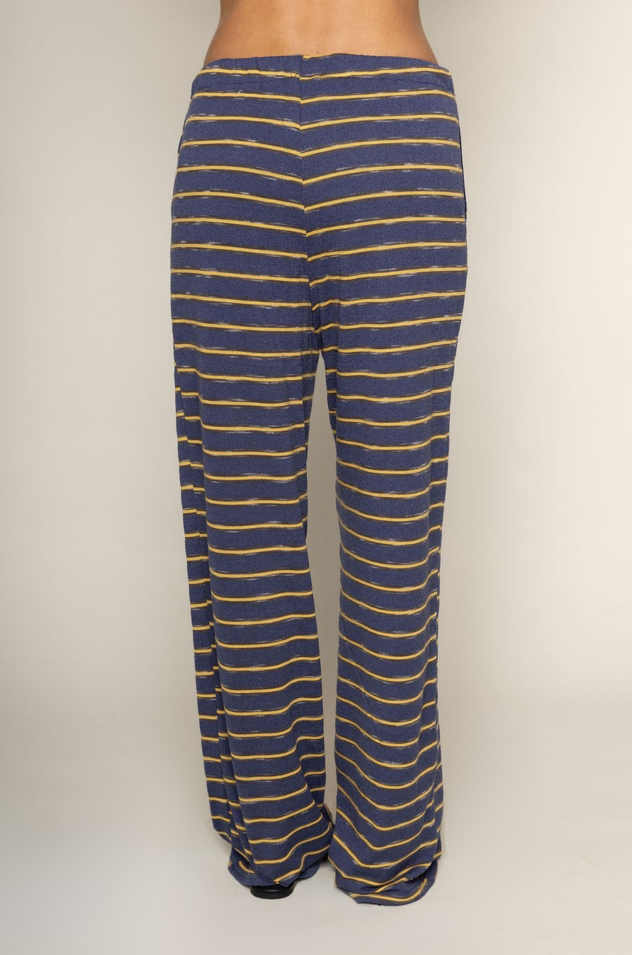 TOP:
blue and yellow Striped knit tube top
Side slits
Rubber grip lining
Unlined

BOTTOM:
blue and yellow Striped knit pants
Elastic waistband
Adjustable waistband tie
Unlined
cute loungewear
beach day outfit
fourth of july cute casual outfit
striped lounge pant set