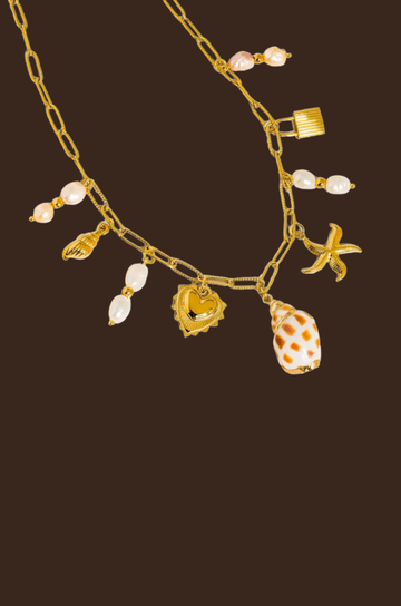 18K Gold Non-Tarnish Shell and Pearl Charm Necklace
18K Gold Plating
Stainless Steel
sea shell charm necklace
