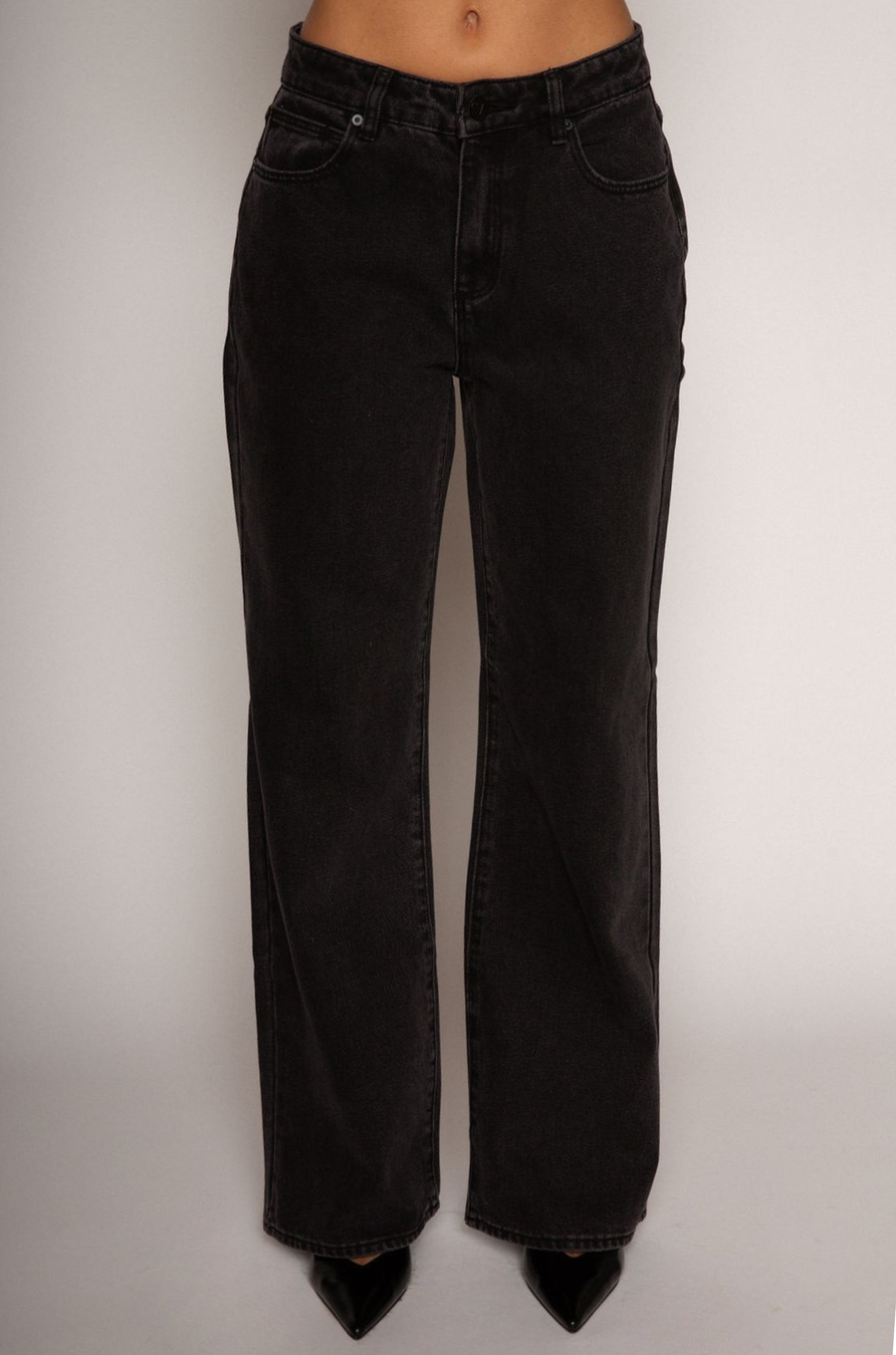 Relaxed fit straight leg jeans. Mid rise. Button and zipper fly. Five pocket construction. Unlined. black denim jeans.