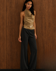 tan Faux leather halter top
Neck button closure
Unlined
