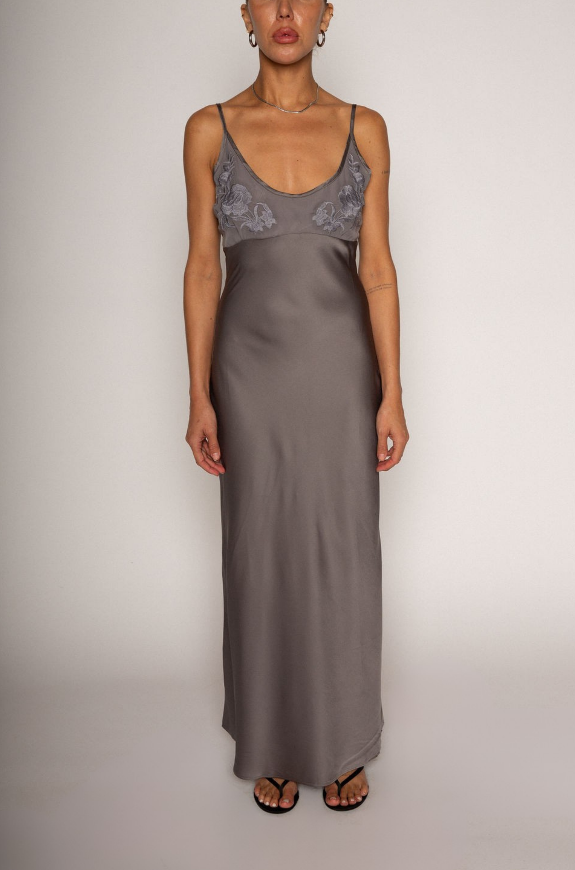 grey Satin maxi dress
Floral embroidered mesh bust
Adjustable straps
Side hook and eye and zipper closures
Unlined