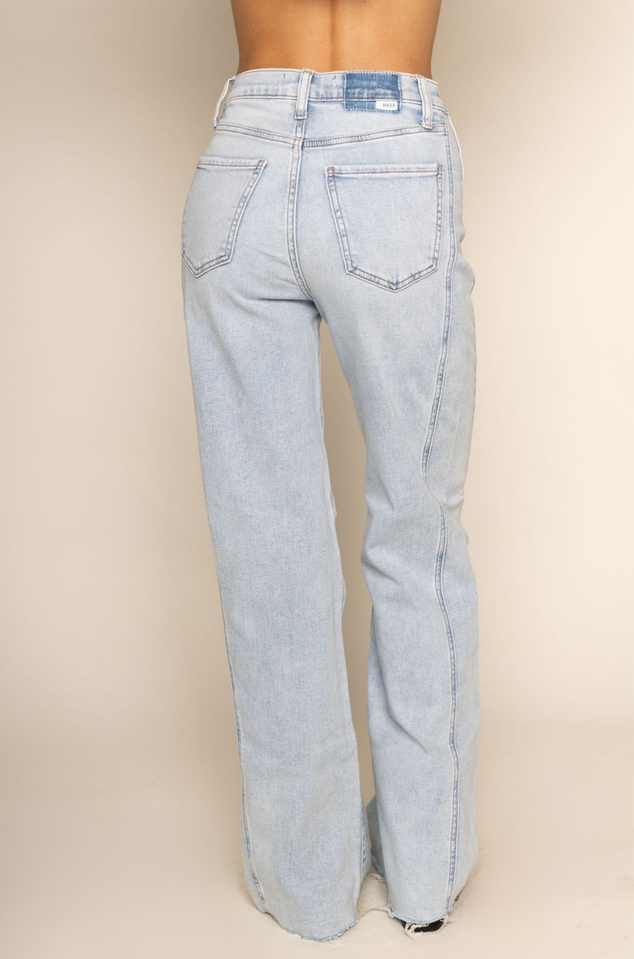 High rise flare leg jean
Button and zipper fly
Five pocket construction
Raw hem
Seamed details
Unlined