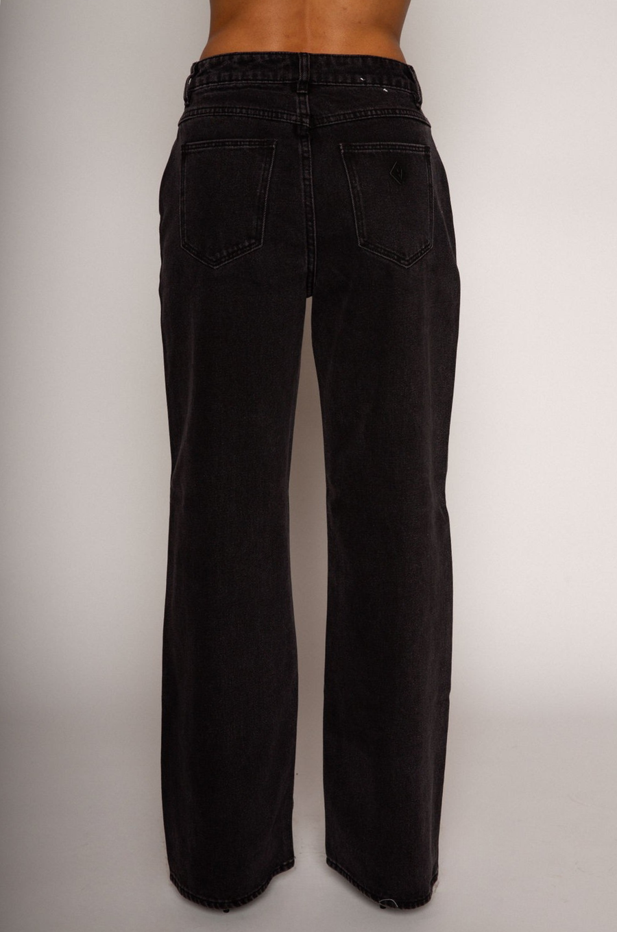 Relaxed fit straight leg jeans. Mid rise. Button and zipper fly. Five pocket construction. Unlined. black denim jeans.