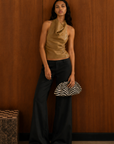 tan Faux leather halter top
Neck button closure
Unlined