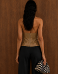 tan Faux leather halter top
Neck button closure
Unlined