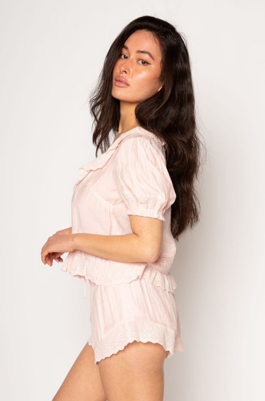 Crinkle woven shorts. Elastic waistband. Eyelet trim. Fully lined.