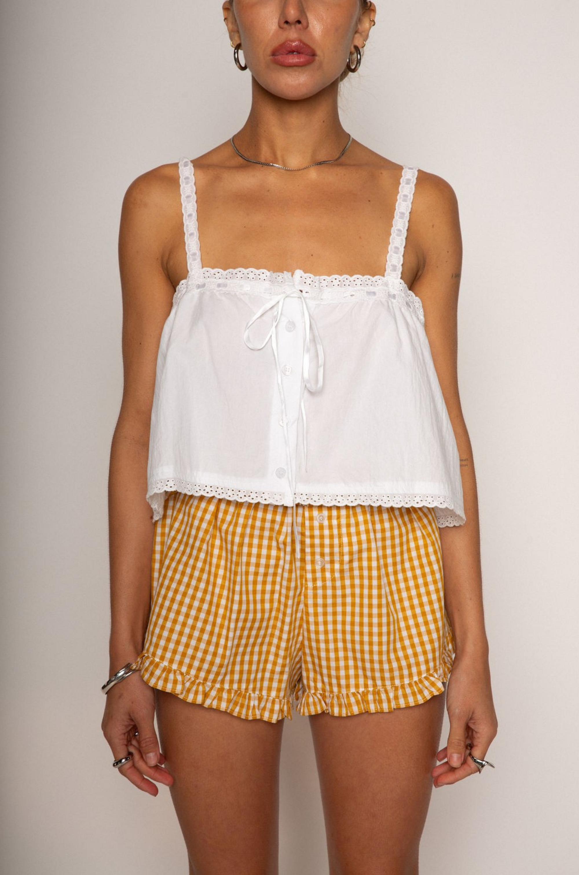 Cropped tank top
Fixed straps
Drawstring neckline
Front button down closures
Crochet trim
White crop top
Coquette tank top
Summer tank top
