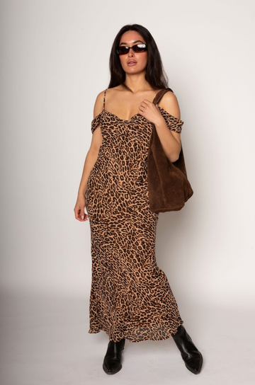 Animal printed chiffon maxi dress. Adjustable straps. Off the shoulder sleeves. Back tie closure. Fully lined. leopard print maxi dress. fall dress. sporing dress. summer dress
