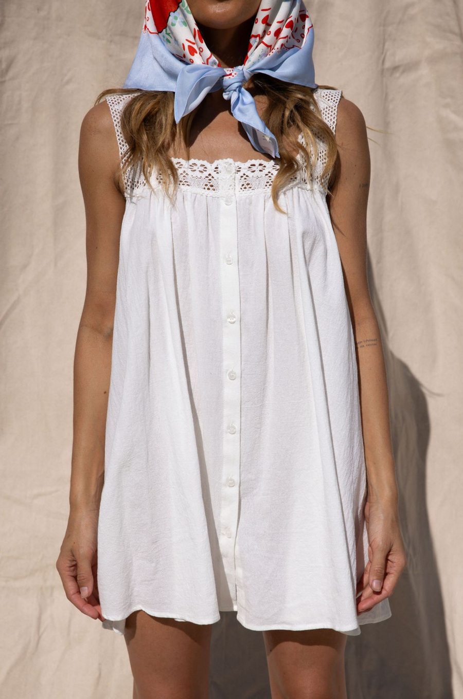 white cotton mini dress with lace straps. festival outfit. country concert dress. stagecoach dress outfit