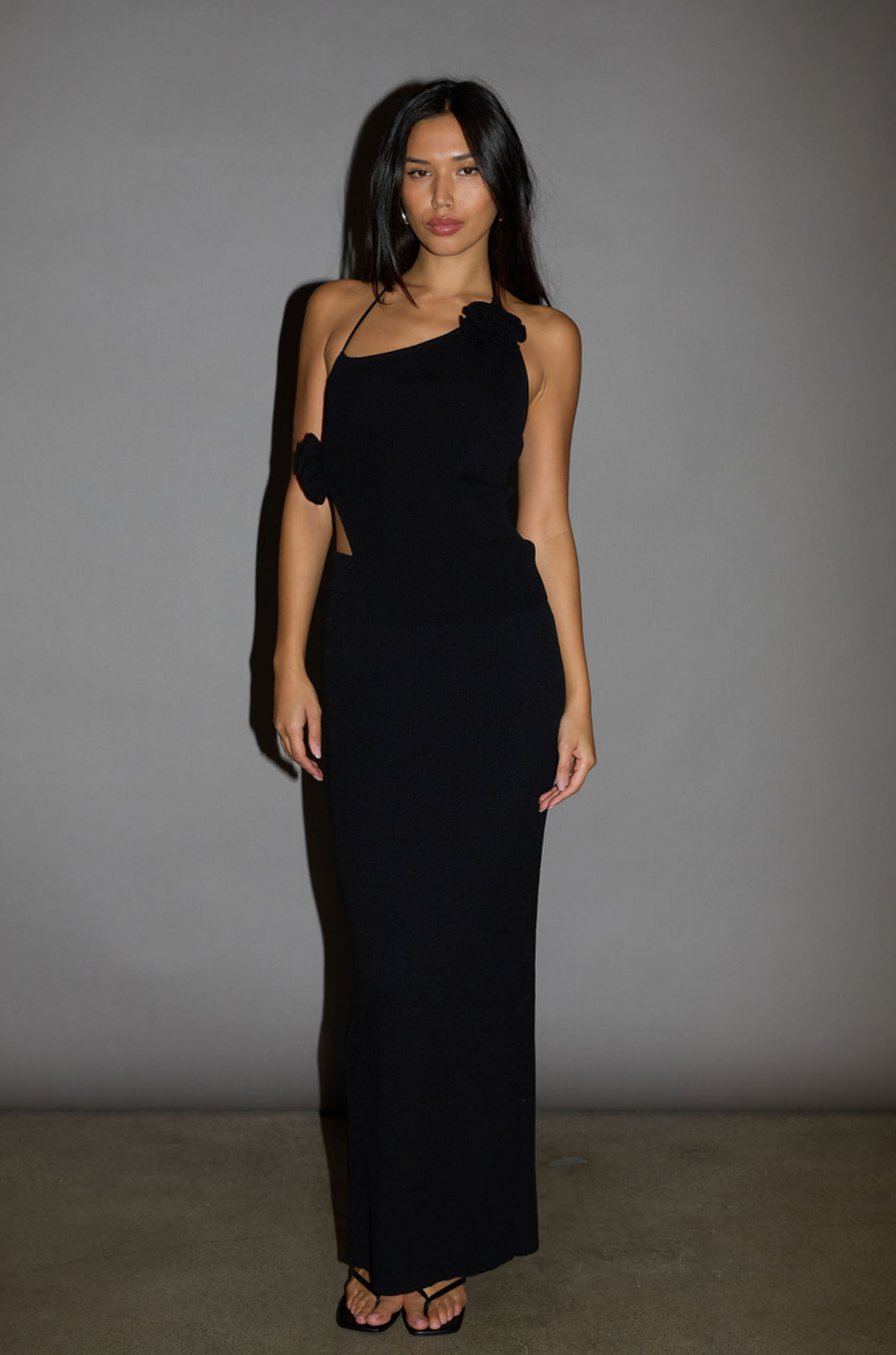 TOP:  Black Ribbed knit tank top. Adjustable halter tie neckline. Rosette details. Side slit. Unlined.

BOTTOM: Black Ribbed knit maxi skirt. Elastic waist. Back slit. Unlined.

Black set. holiday outfit. christmas outfit. nice christmas outfit