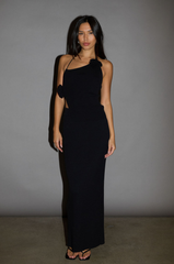 TOP:  Black Ribbed knit tank top. Adjustable halter tie neckline. Rosette details. Side slit. Unlined.

BOTTOM: Black Ribbed knit maxi skirt. Elastic waist. Back slit. Unlined.

Black set. holiday outfit. christmas outfit. nice christmas outfit
