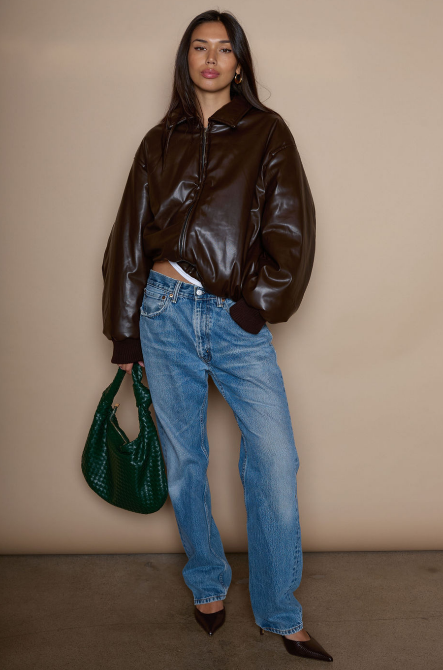 Faux leather jacket. Collar neckline. Long sleeves with elastic openings. Front zipper closures. Side pockets with snap button closure. Elastic hem. Fully lined. brown puffer jacket. brown puffer bomber jacket. fall jacket. bomber jacket. going out jacket