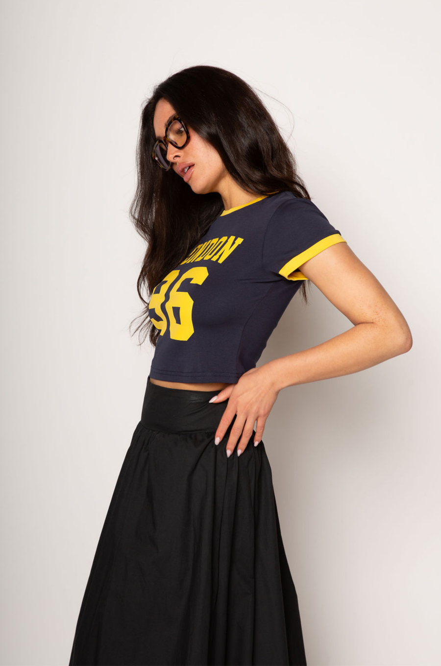 Graphic printed knit crop ringer tee. Crewneck. Short sleeves. Unlined. london graphic tee. baby crop tee