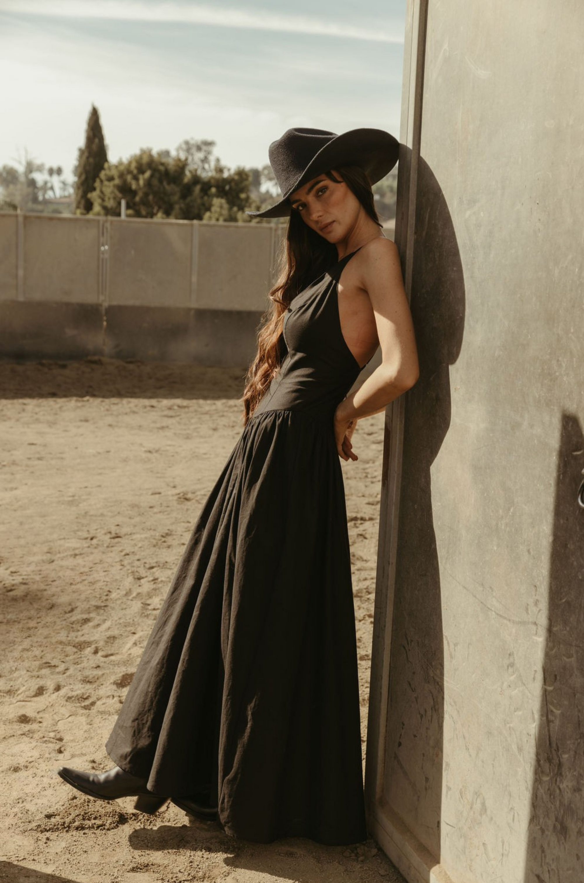 Woven maxi dress. Adjustable crisscross back straps. Back hook and eye and zipper closures. Fully lined. black maxi dress. country outfit. country dress. western outfit. western dress.