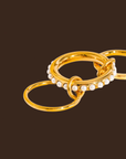 18K Gold Non-Tarnish Multi Stack Pearl Band Ring
18K Gold Plating
Stainless Steel
Size 8 Measurement: 0.714 Diameter/2.24 Circumference
Lead-free
Nickel-safe
Hypoallergenic
Water Resistant